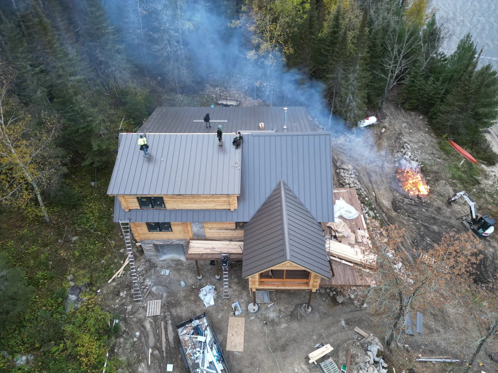 Sample project page photo, Before: standing seam metal roof on a timber lodge