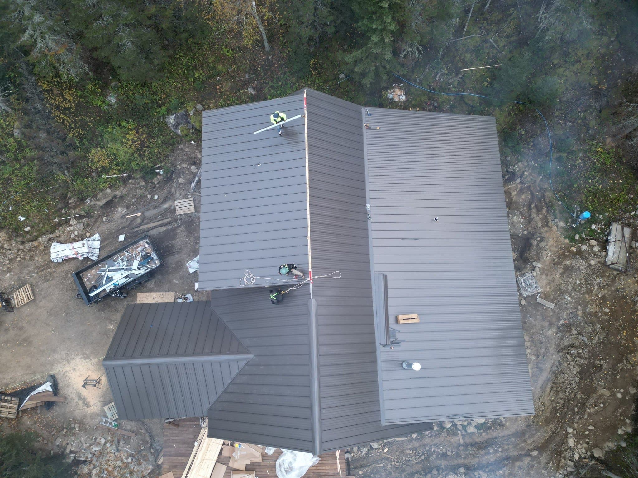 Standing seam metal roof on a log lodge by a lake in Crane Lake, photo 3 of 4