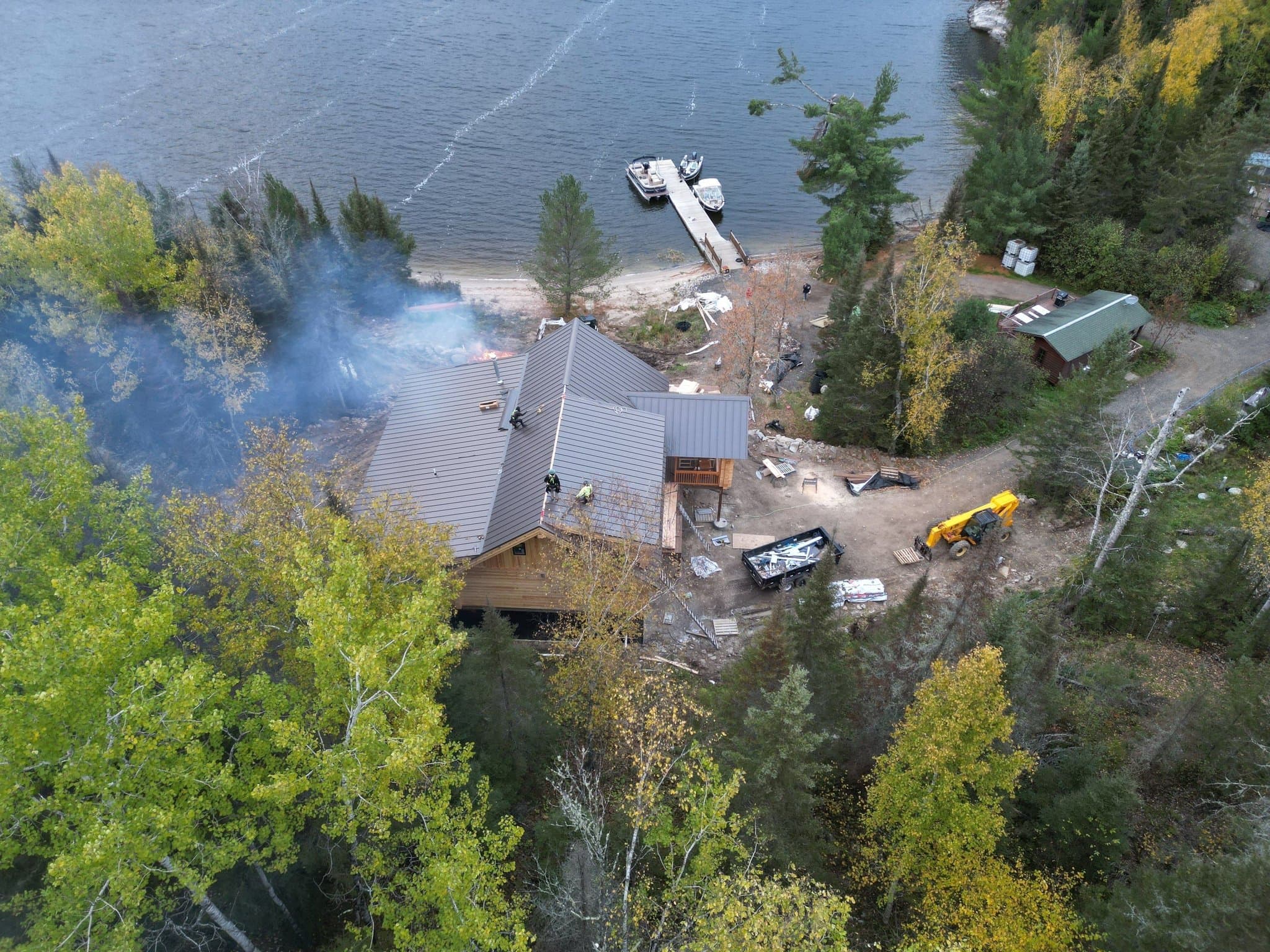 Standing seam metal roof on a log lodge by a lake in Crane Lake, photo 4 of 4